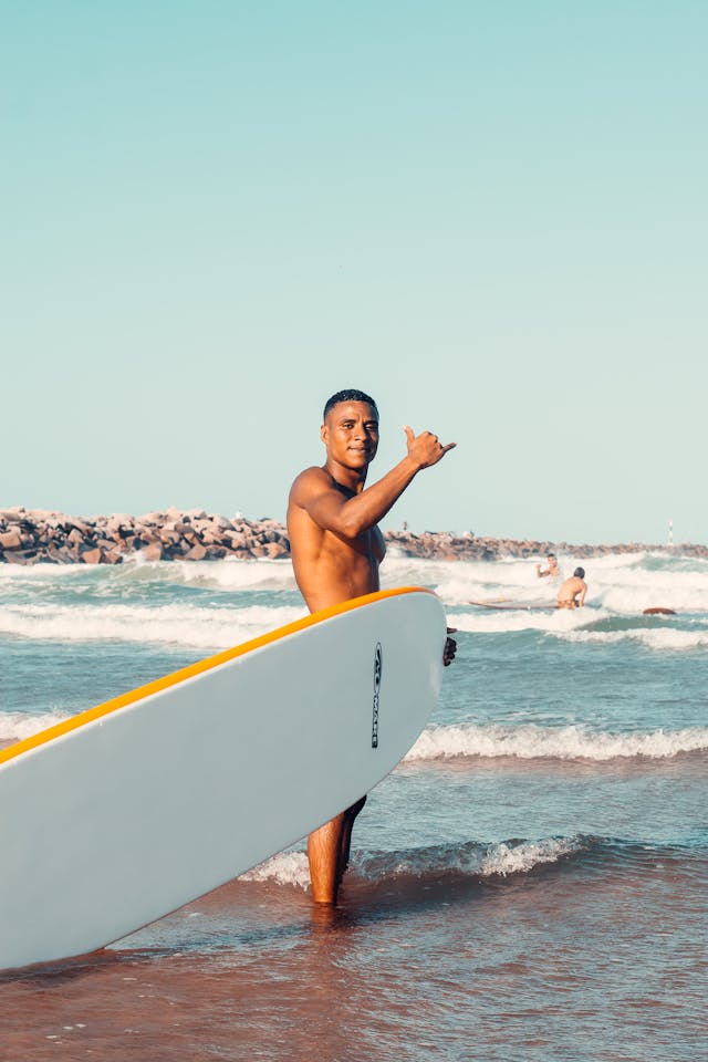 A man with Surfboard