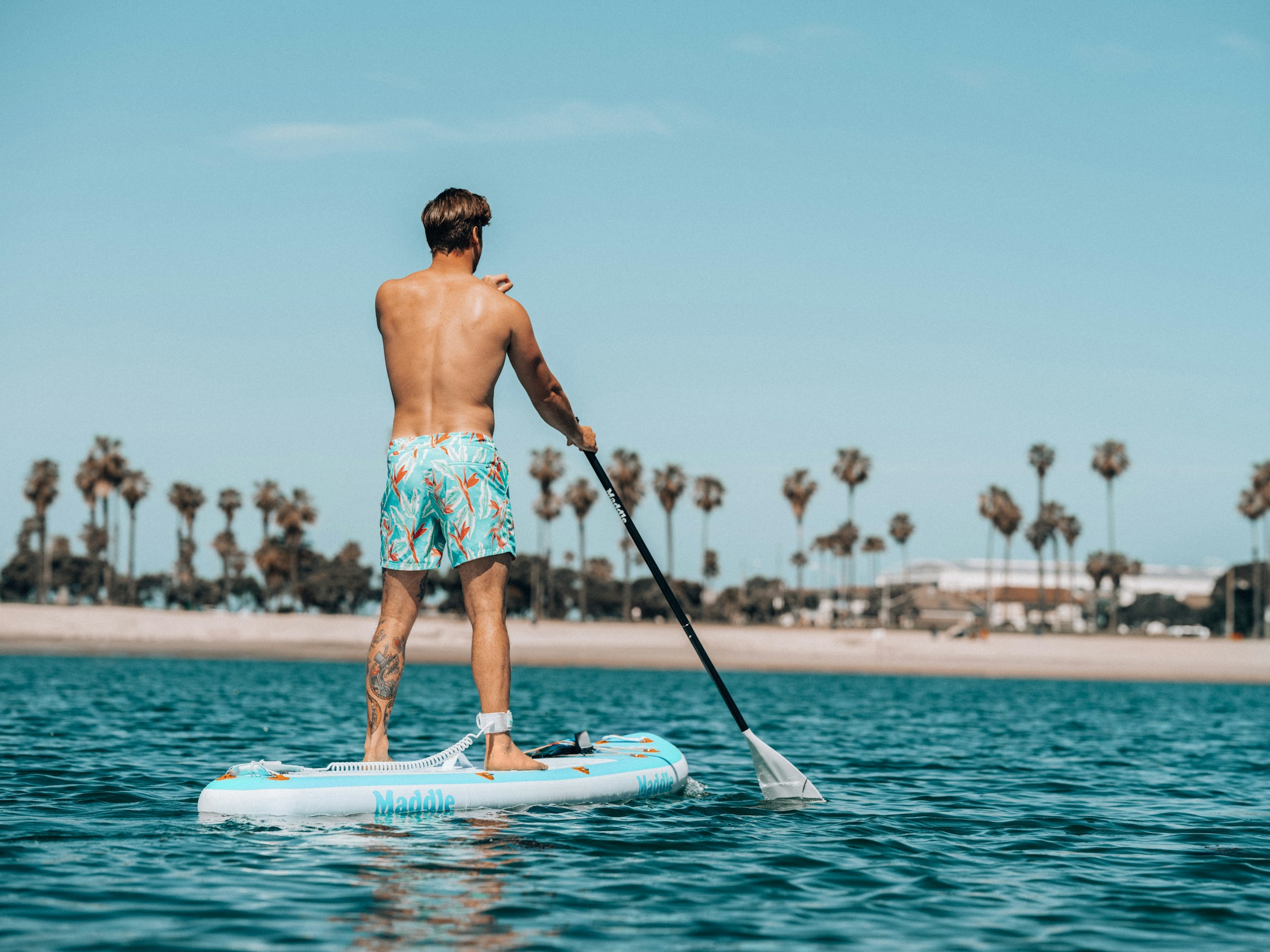Man with surfing with paddle