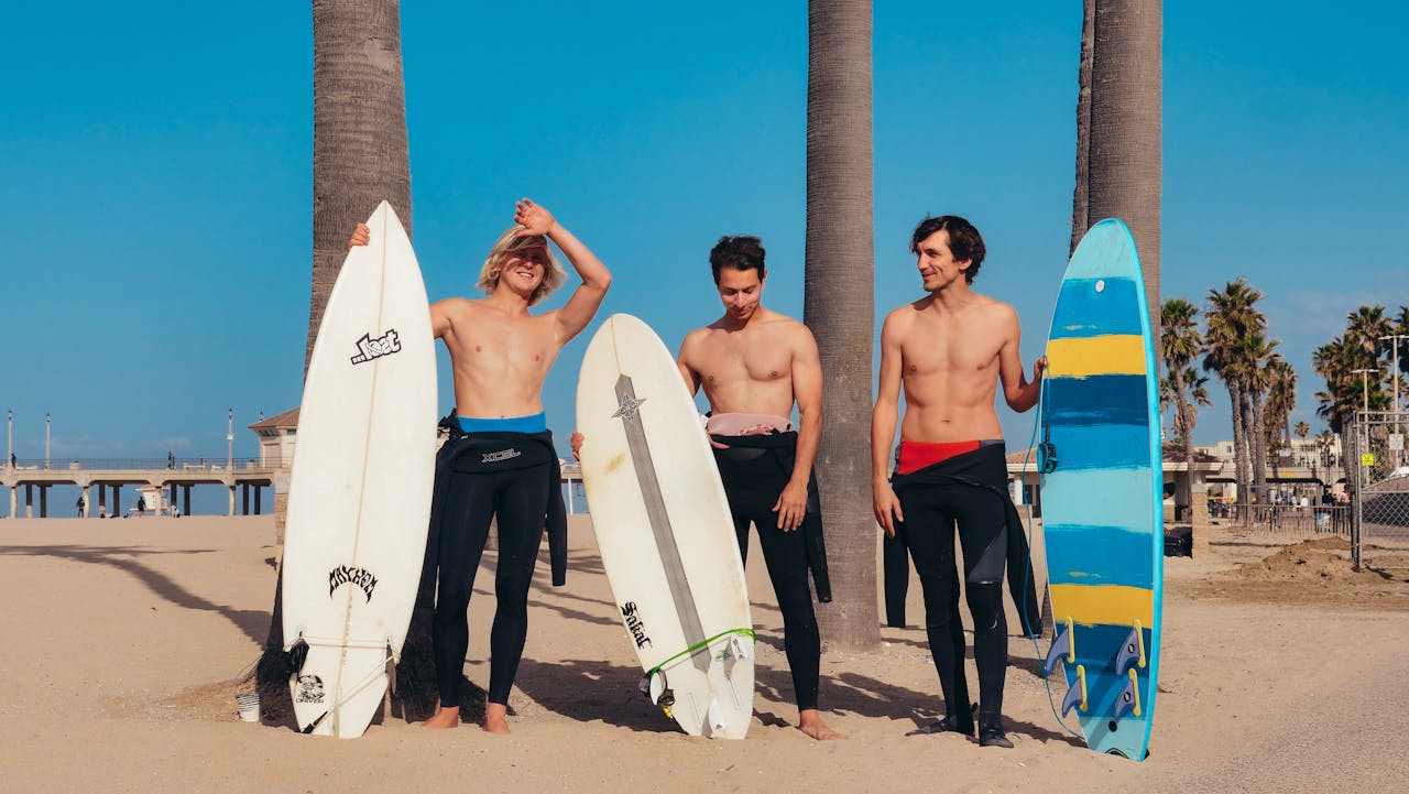 Group of men standing with Sufboard